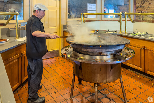 DIners will enjoy the open wok cooking at Mongolian BBQ, a short distance from Crown Point.