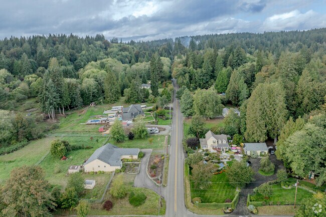 Homes on acreage with heavy wooded areas are common in Burley WA.