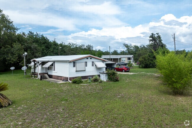 Rows of manufactured homes line streets in Pine Lakes.