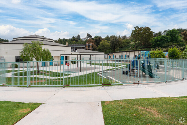 Students flock to the playground at Charles Helmers Elementary School during recess.