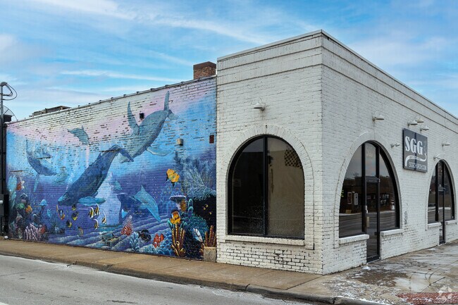 Under the Sea mural painted on the side of a building in Central City neighborhood.