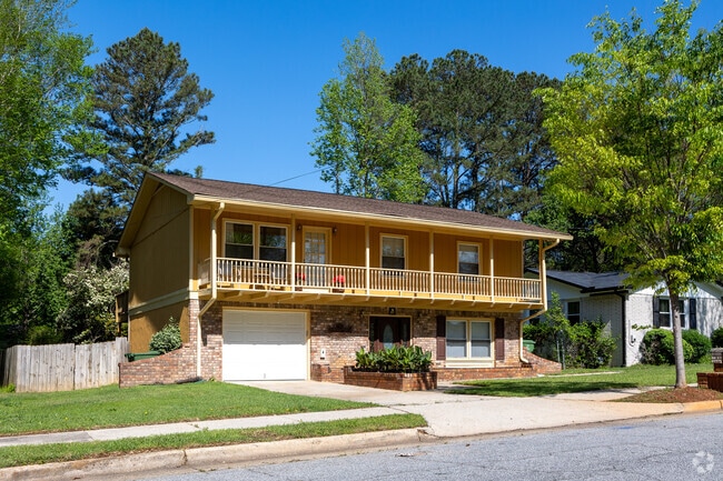 A two story traditional house with a beautiful second level porch.