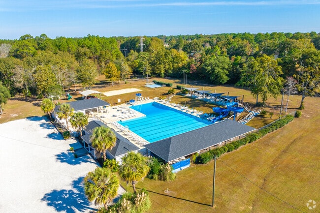 Swim laps or lounge at West Mobile Swim Club in summer.