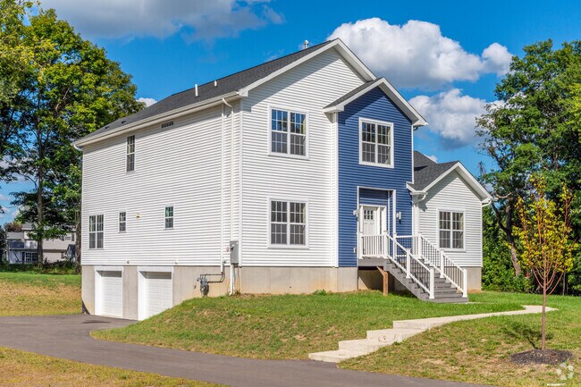 New traditional homes in Montgomery feature porches with steps leading to welcoming entries.