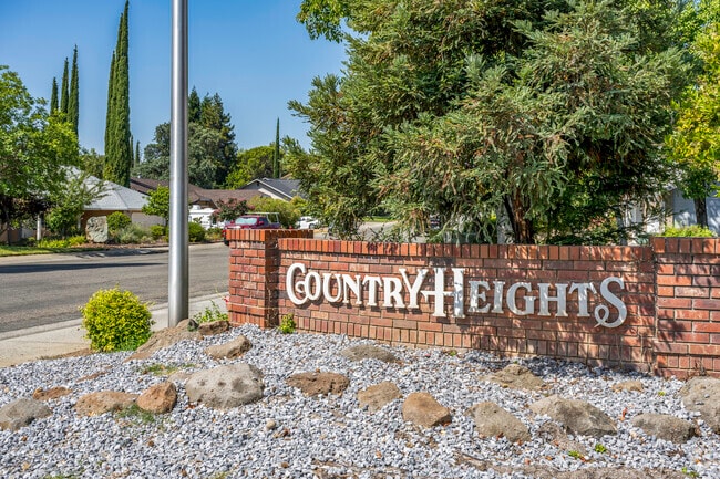Country Heights has a brick sign welcoming you to the neighborhood.