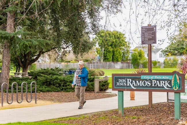 Afternoon walkers pass through tree-lined paths at Ramos Park in Palo Verde.