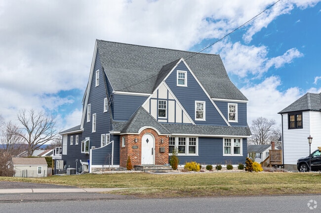 A larger contemporary home in Wethersfield stands out from its historical neighbors.