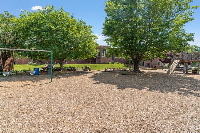 Redeemer School's playground also features a swing set and benches in the shade.