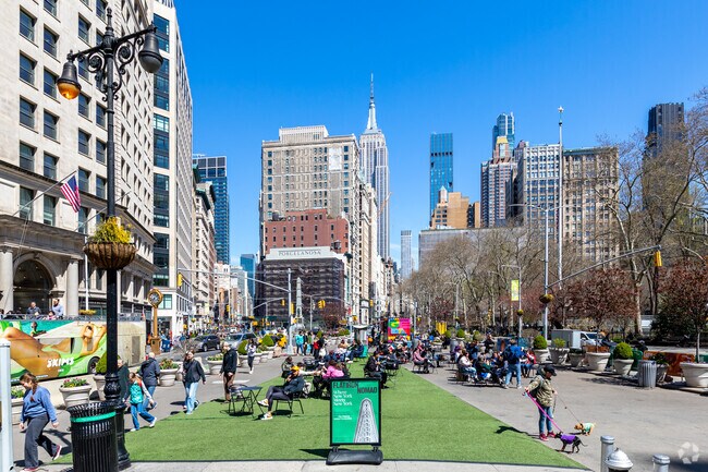 Flatiron Public Plaza is right out of the Flatiron District and is a great meeting spot for locals.