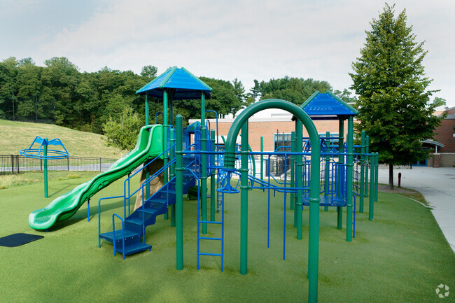 Students can play on the turf playground during recess at Memorial Elementary School.