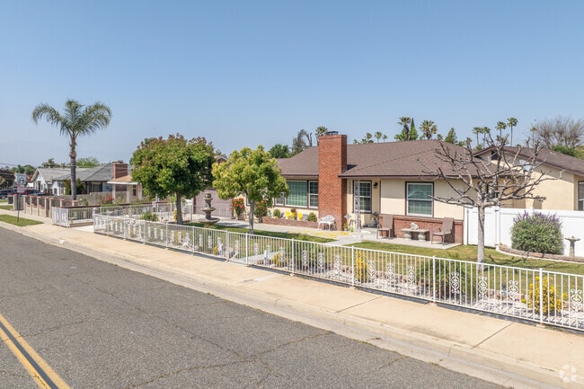 A row of fenced mix-architecture single-family homes lines the street in Arlington