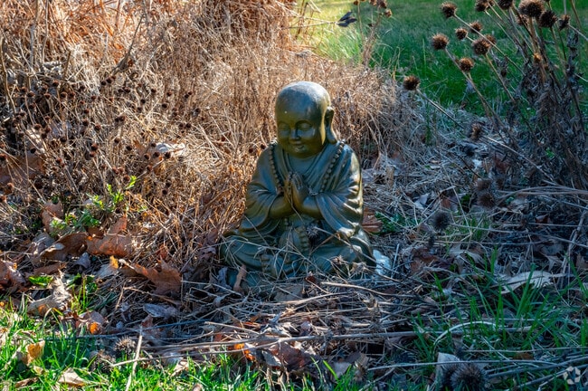 A Buddha lawn decoration reflects the serenity Mount Rainier residents cultivate.
