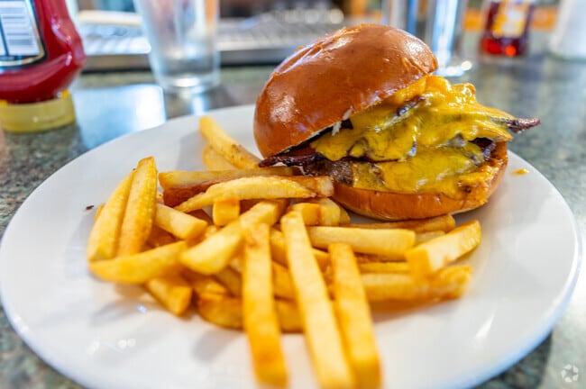Crispy fries and cheese smothered burgers are served at Gramia's in Earl.