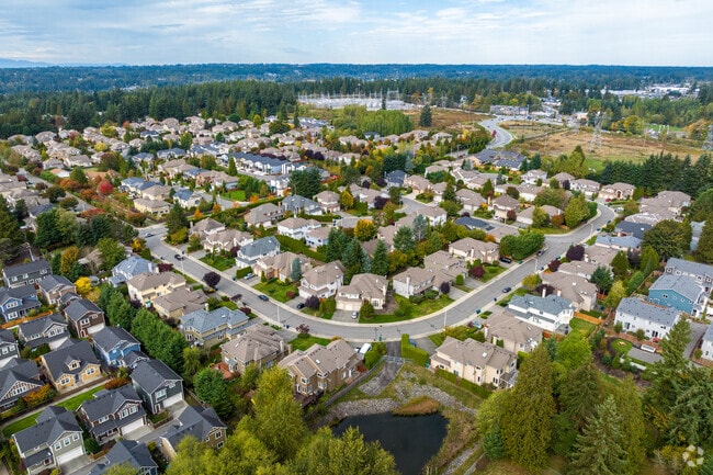 Suburban homes line a quiet streets in Canyon Park, framed by trees and well-kept lawns.