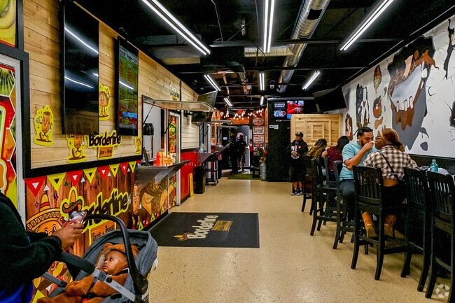 A unique eating experience, Whatcha Wanna Eat Food Hall offers several food vendors to enjoy.