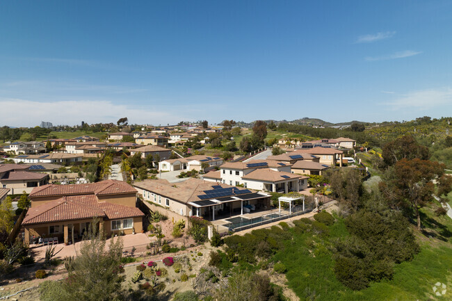 Backyards of modern Mediterranean homes have Arrowood Golf Course views in Morro Hills.