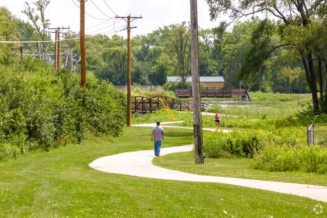 A walking path meanders through Armstrong Park located in Carol Stream.
