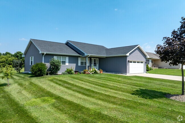Newly constructed homes in Darien, Wisconsin, feature manicured lawns and modern designs.