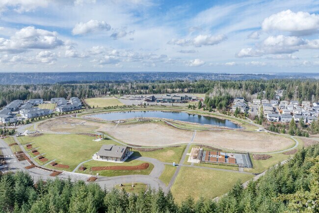 Discovery Park offers plenty of open space, picnic tables, seating, and even a hefty rock circle with views in Tehaleh Washington.