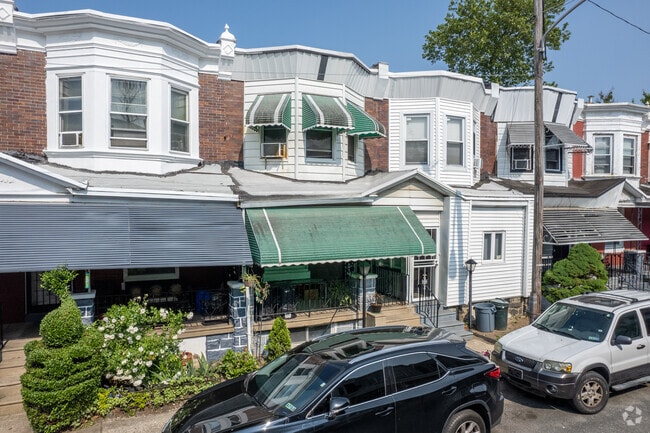 Row homes with Victorian touches and covered porches can be found in the Haddington neighborhood