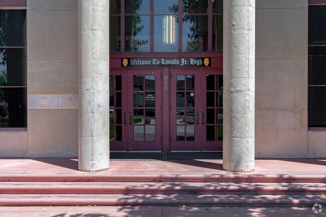 The entrance to Lincoln Junior High School features traditional columbs.