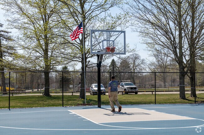 Pausing for a few hoops on the court at the Berkley Commons in Berkley.