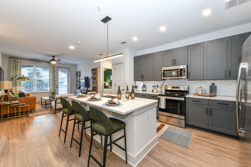 Kitchens are complete with an entertaining island and quartz countertops.