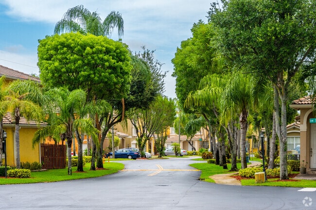 Residential street with single family homes in gated community of Vanderbilt Park.