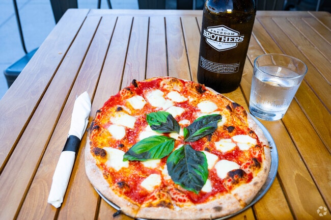 Enjoy a delicious pizza from Freedom Brothers Pizzeria & Alehouse in Naperville.