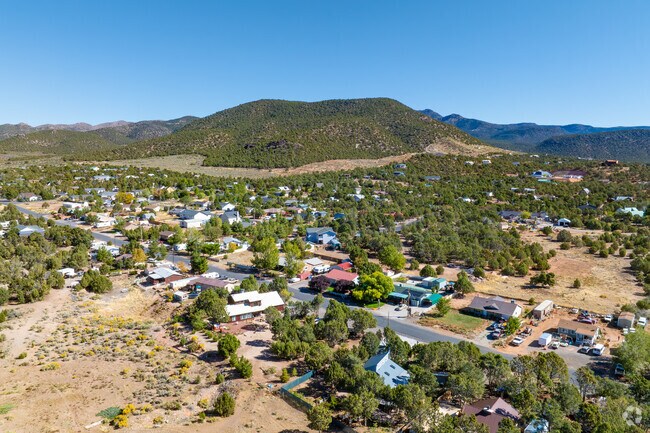 Neighborhood roads weave among large-lot homes and desert shrubs.