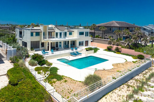 This sprawling Ormond by the Sea estate has multiple outdoor areas and a spacious private pool.