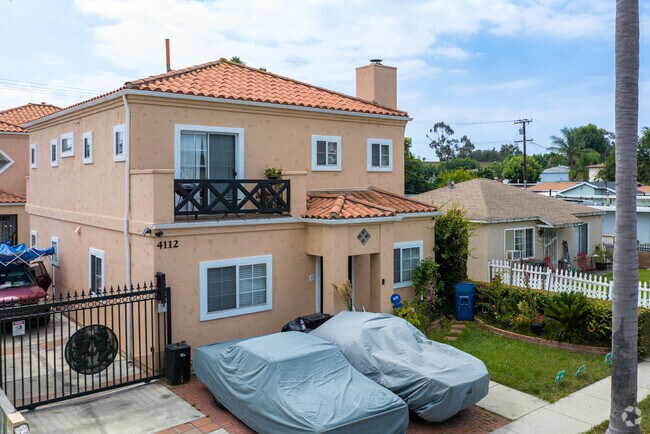 Choose a two-story Spanish home with a terracotta roof in Lawndale, California.