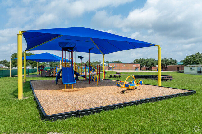 Students enjoy the expansive playground at Rustic Oak Elementary.