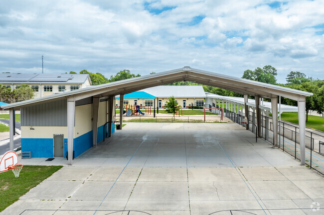 Students play in the shade at Meadowbrook Elementary School.