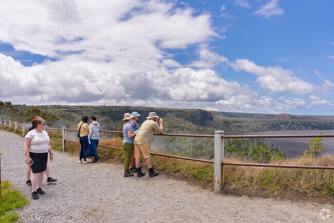 Steam vents, lava tubes, and recent lava flows are visible throughout the surrounding park area.