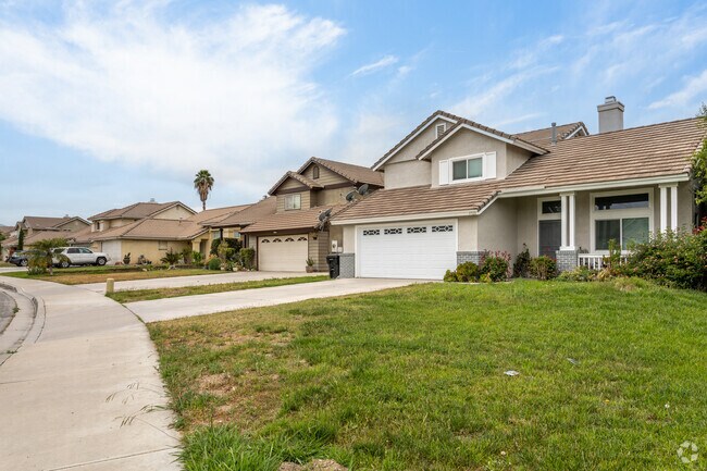 A row of beautifully designed single-family homes with tile roofs in the Valley View.