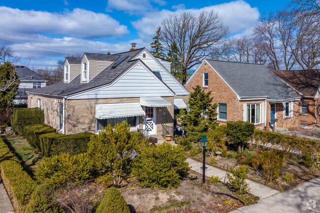 Nicely landscaped Cape Cod homes in Milwaukee's Honey Creek Parkway neighborhood.