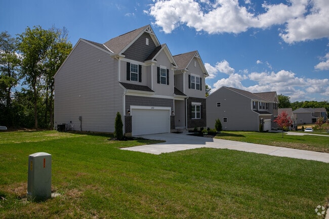 Newly built homes line this Forest Park street.