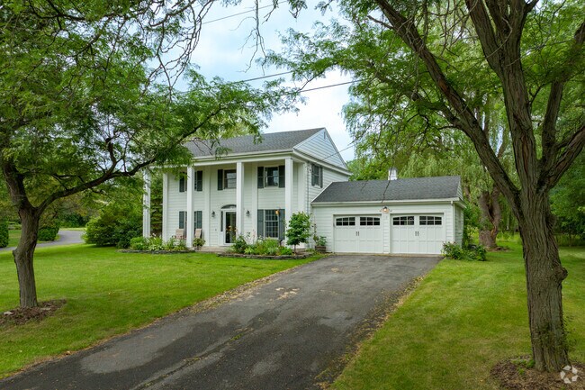 Northeast Ithaca homes tend to be wooded and set farther back from the road.