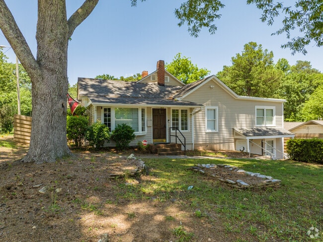 Shaded by sprawling trees, cozy cottages offer a laid-back lifestyle in Austin.