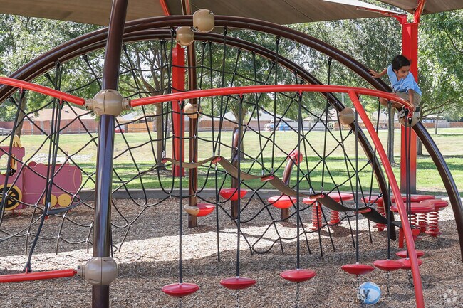 Look mom, I can climb to the top of the playground equipment at Katy Railroad Park.