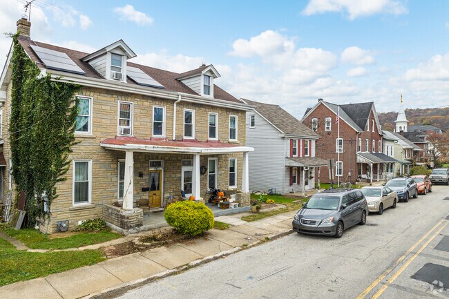 Older duplexes sit alongside a small colonial in the historic section of Downingtown.