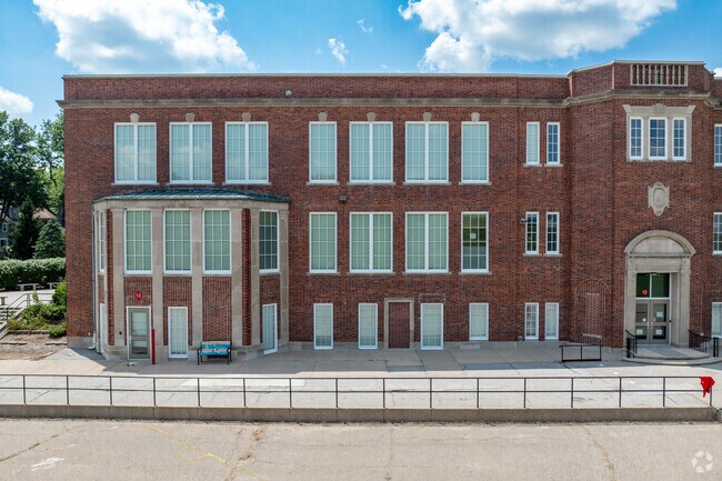 The building for Sheridan Elementary School is made of red brick.