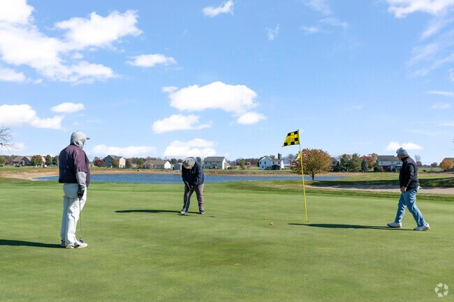 Many residents meet with their friends to play a game of golf.