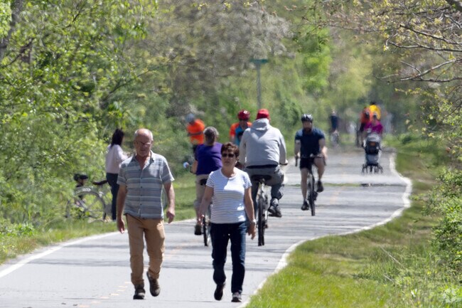 Cyclists and pedestrians alike enjoy the East Bay Bike Path along the boundary of Nayatt.