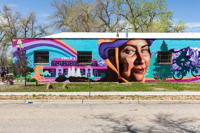 An art mural in the TO Smith neighborhood adds a vibrant and colorful touch to the area.