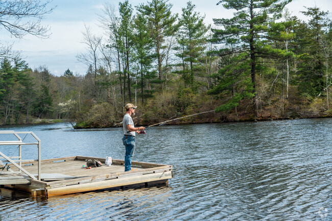 A man fishes off the dock at Dunn Pond located in Gardner's Dunn State Park.
