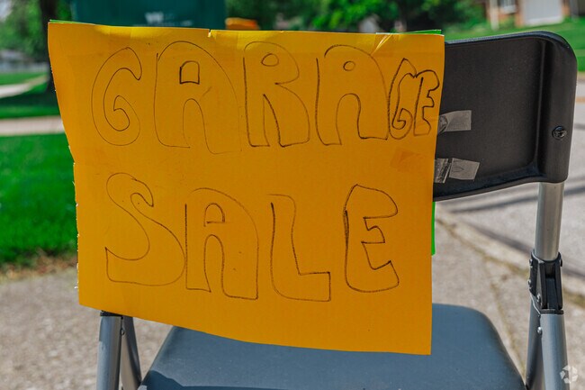 Garage Sale signs line yards and streets during the city wide garage sale in Seven Hills.