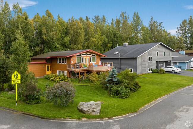 Large split-level homes with ample-sized lots sit on manicured lawns in the University Area.