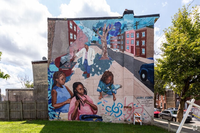 Saturday afternoon mural on Thompson Ave in Carroll Park.